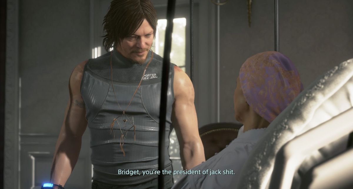 in a cutscene in Death Stranding, a man in a gray top, Sam Bridges (Norman Reedus), tells a woman lying in a bed, “Bridget, you’re the president of jack shit”