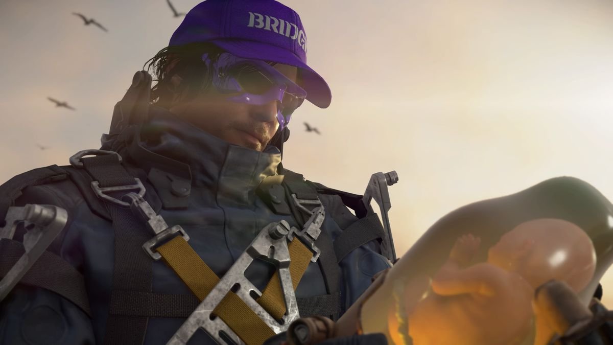 Sam Bridges, a man in a futuristic spacesuit wearing a purple hat that says “BRIDGES” and purple-rimmed sunglasses, holding a baby in a jar in Death Stranding