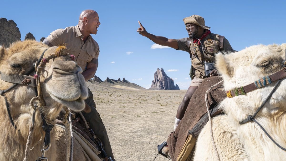 Johnson and Hart argue from atop camels.