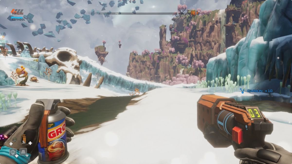 Journey to the Savage Planet the planet AR-Y26 with a giant skeleton and cliffs in the background
