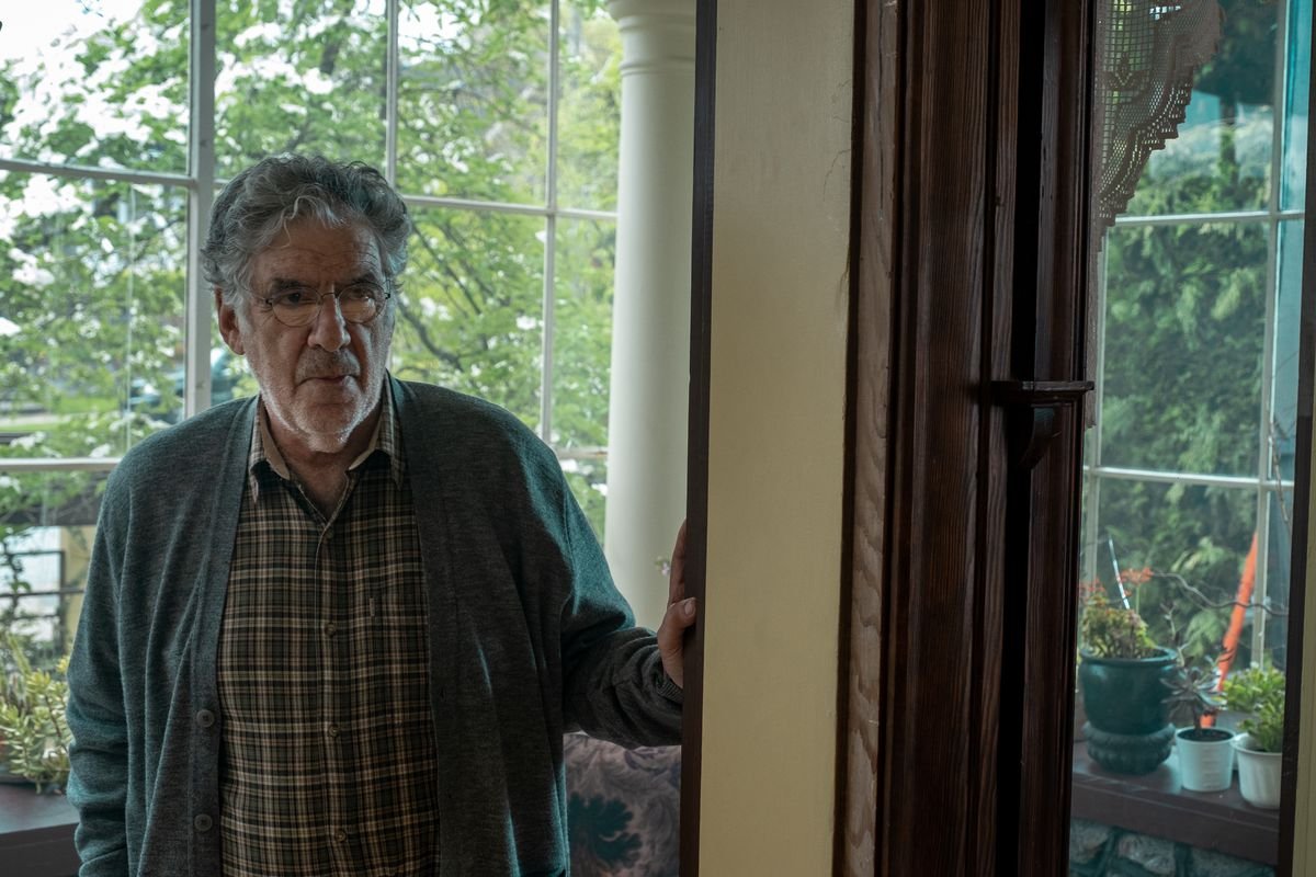 an old man by a window