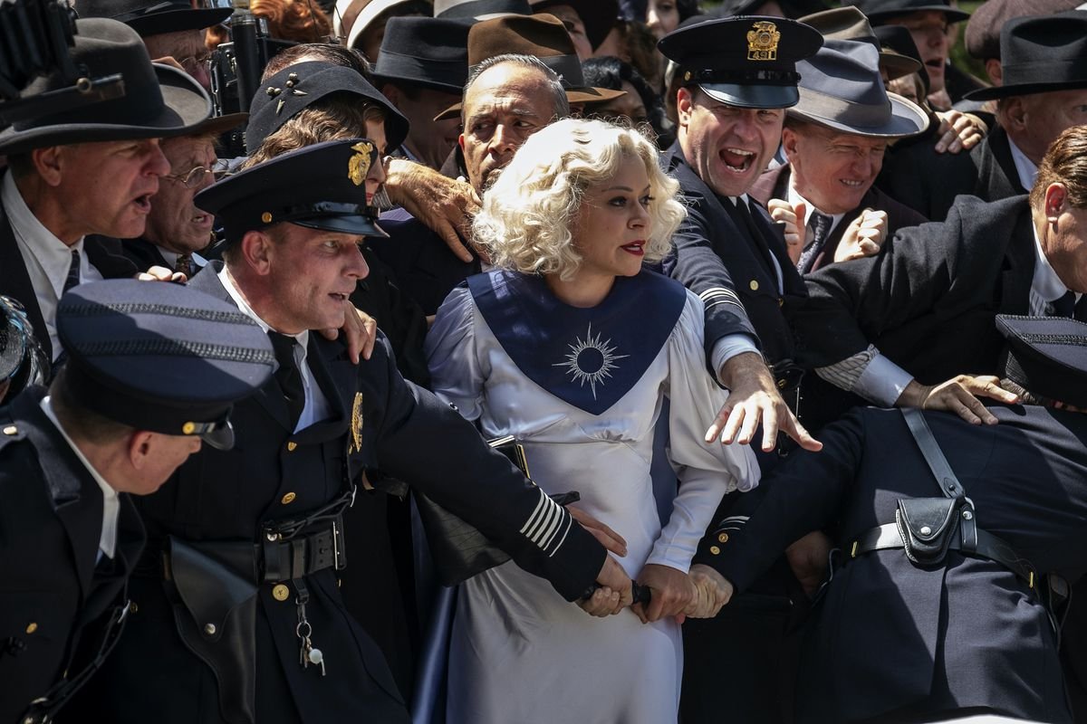 Excited cops surround Tatiana Maslany in HBO’s Perry Mason reboot.