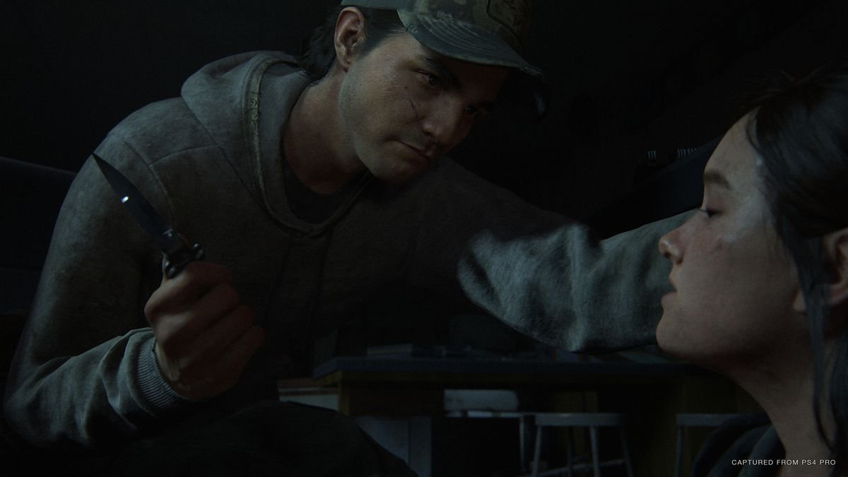 a man menaces Ellie with a knife in The Last of Us Part 2