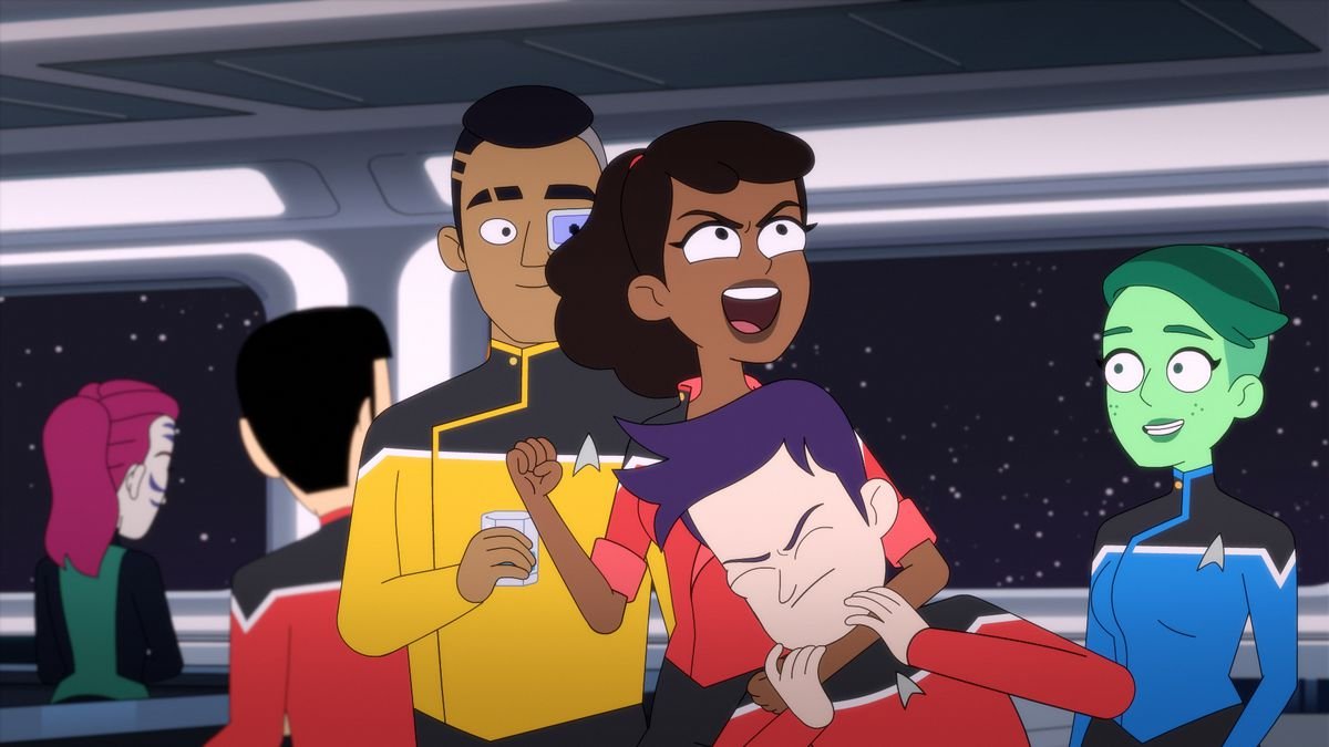 One character in Star Trek: Lower Decks puts another in a headlock as a group of characters stands together in front of a star field.