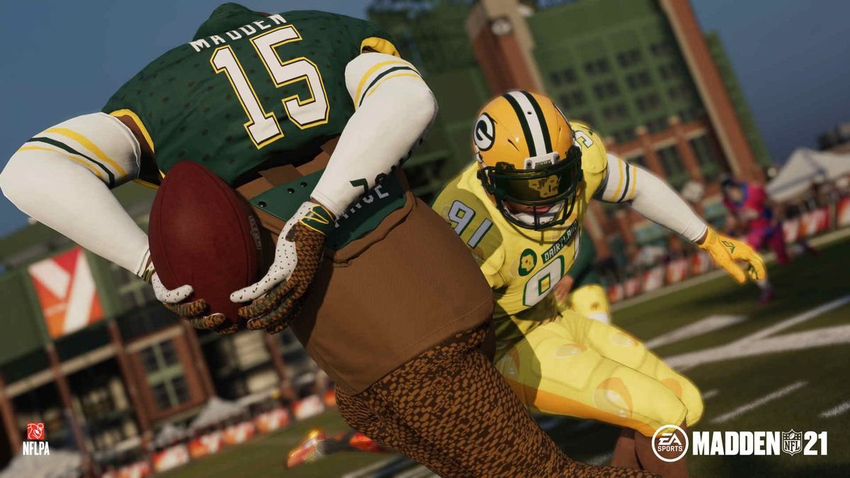 a player hides the ball behind his back to avoid a defender in Madden NFL 21’s The Yard
