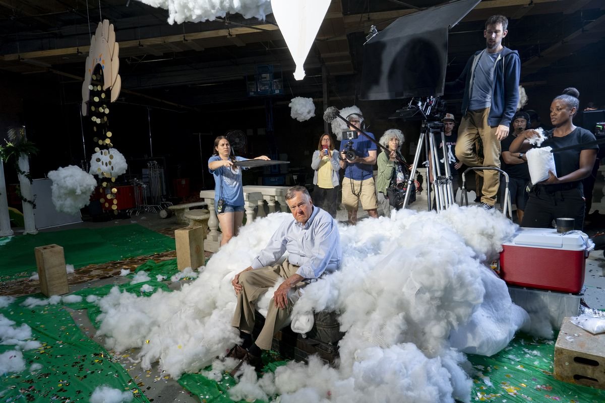 dick johnson sits amidst a ton of white fluff