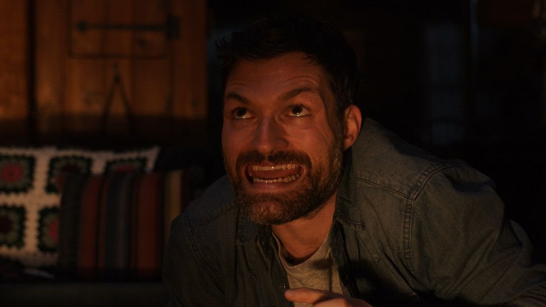 Josh Ruben makes a goofy monster face in Scare Me