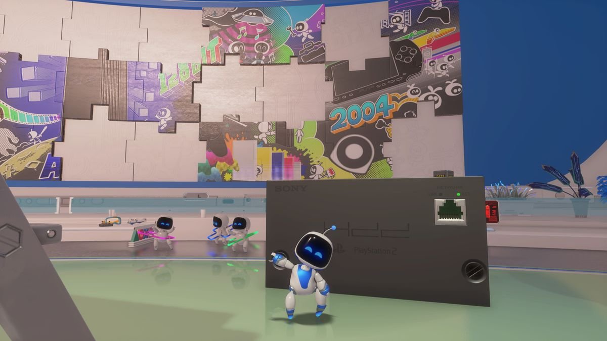 Astro poses in front of a PlayStation 2 network adapter