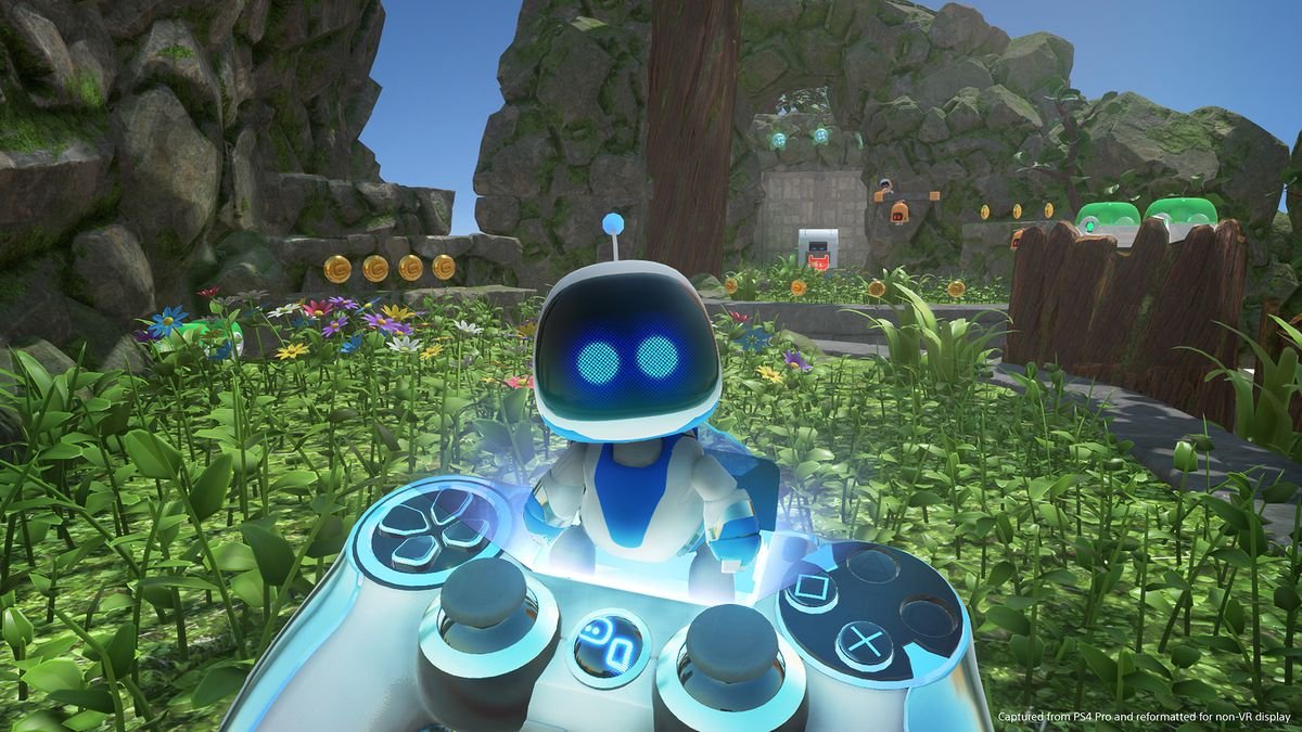 holding a controller in front of a robot in a field in Astro Bot Rescue Mission