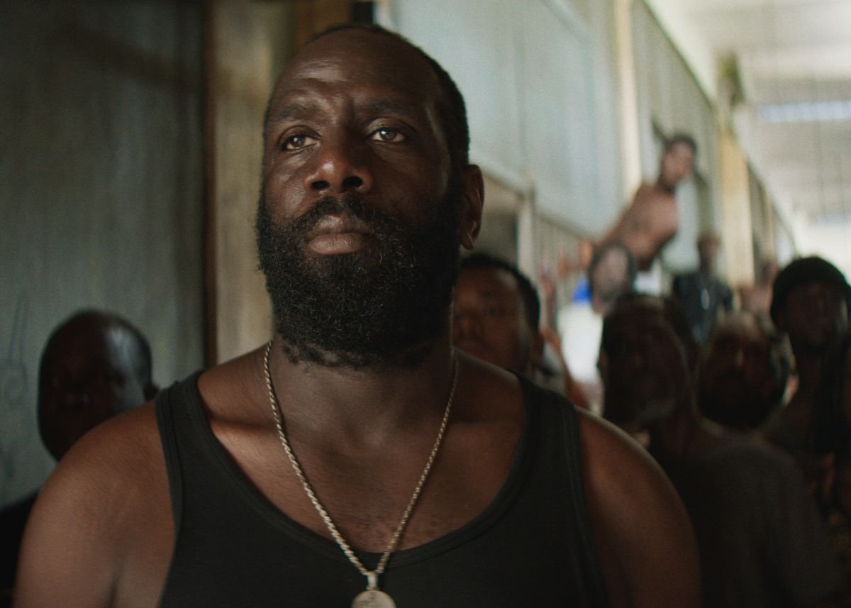 a bearded man in front of a crowd