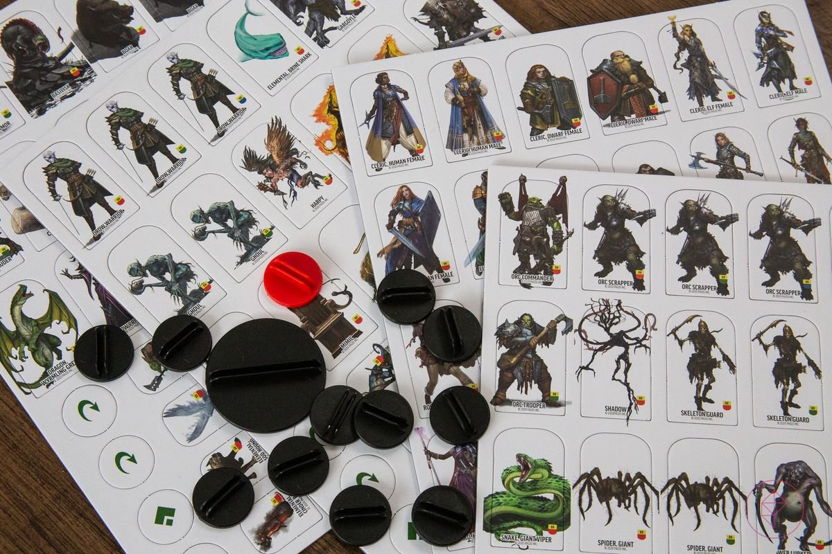A selection of cardboard tokens, 124 in all, with plastic standees.