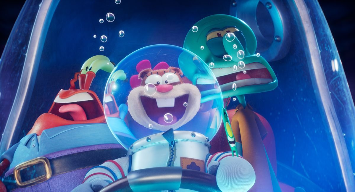 Sandy Cheeks looks delighted and Mr. Krabs and Squidward look squished as they stand in a doorway in Sponge on the Run.