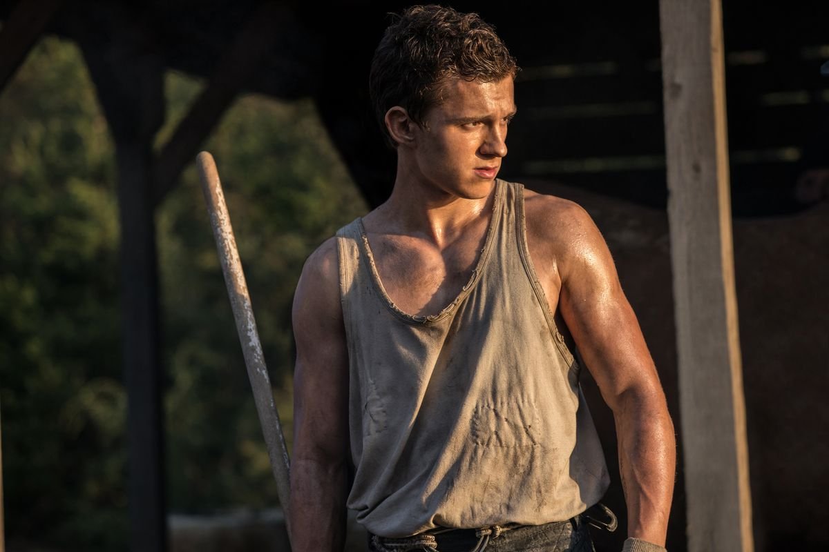 Tom Holland looking especially ripped in a browning tank top in Chaos Walking