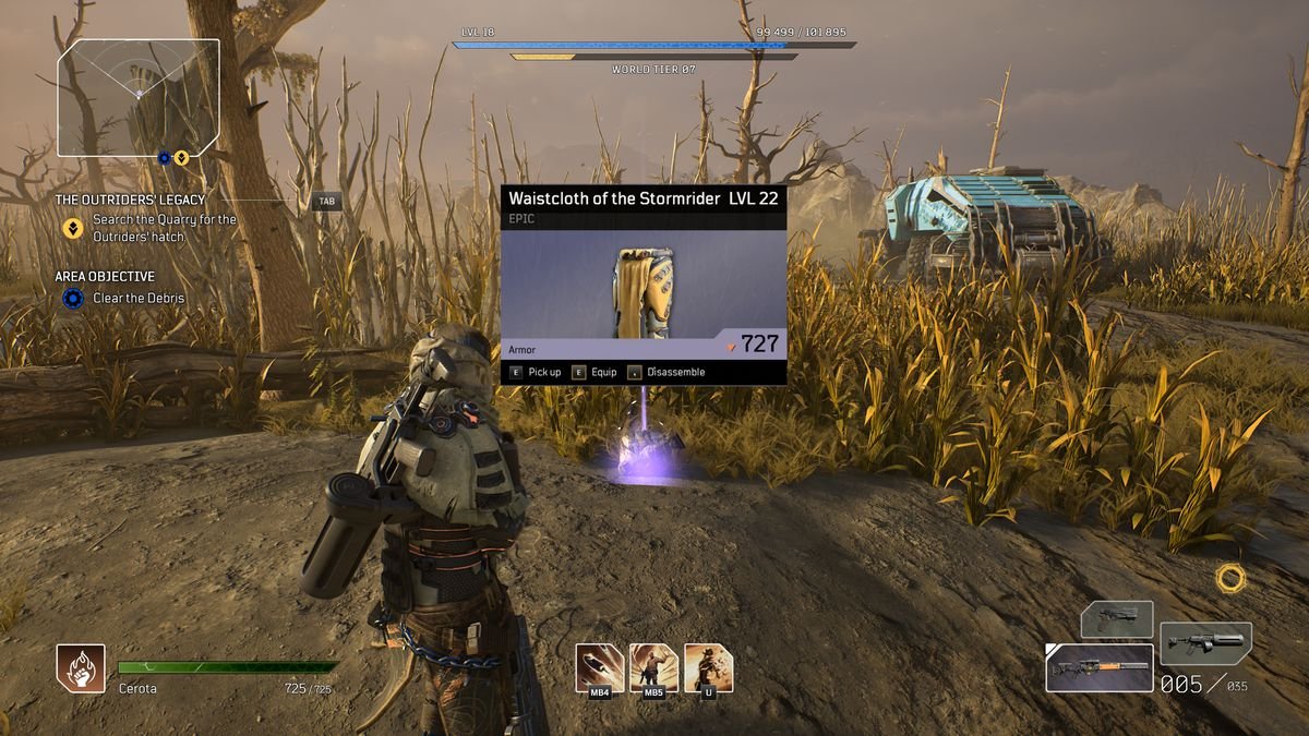 The player character in Outriders inspects a piece of loot before picking it up