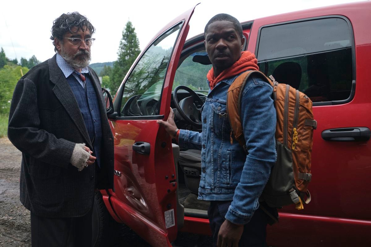 Alfred Molina and David Oyelowo stand by a red truck looking concerned in The Water Man.