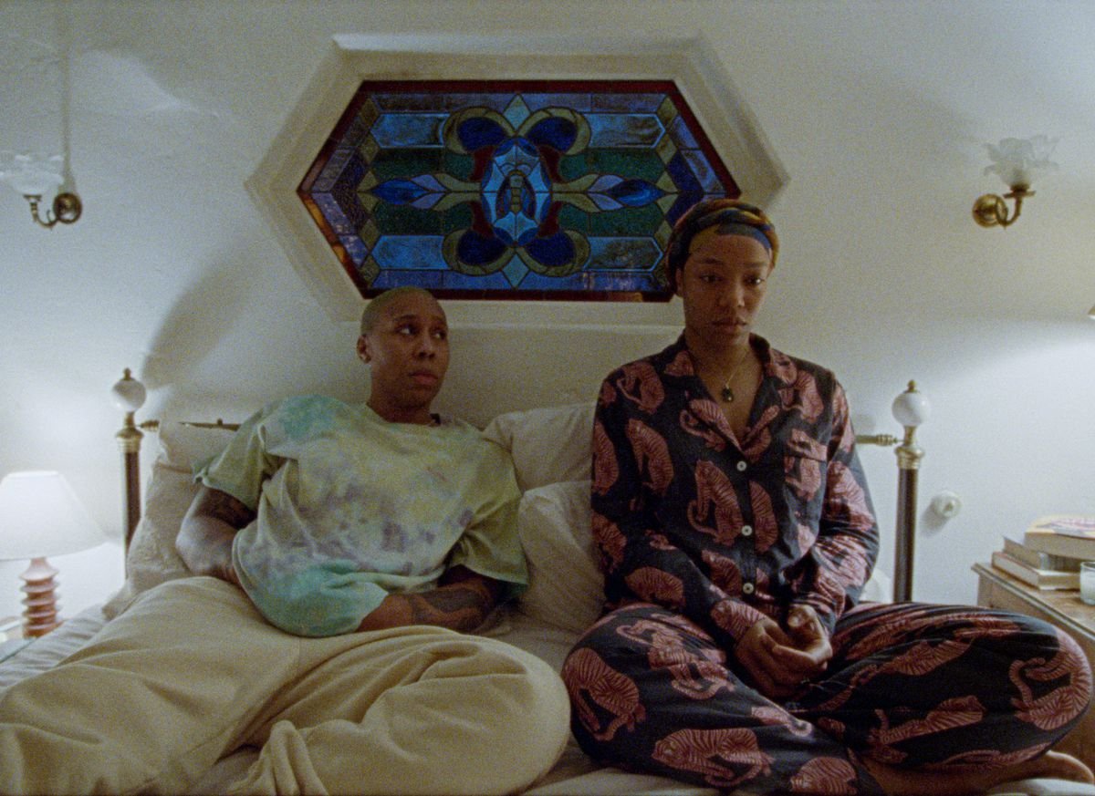 Naomi Ackie and Lena Waithe sit in bed together in Master of None season 3