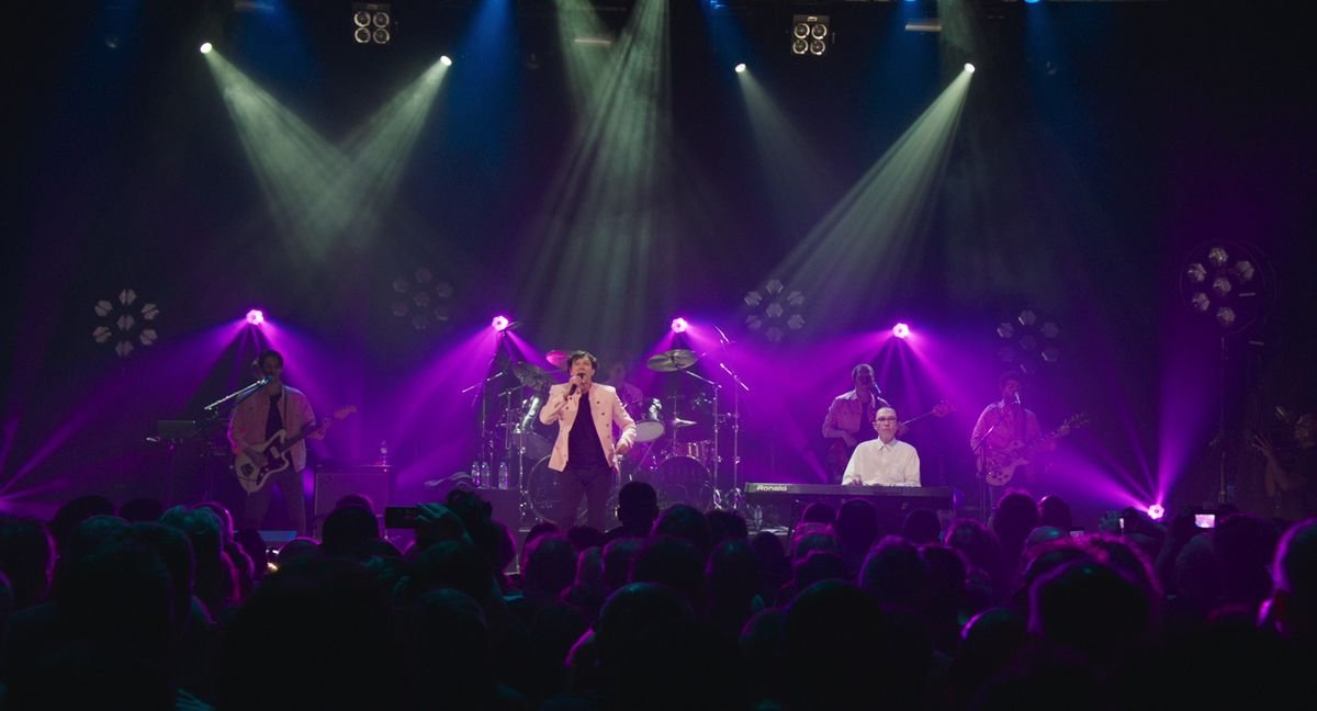 Sparks in concert, surrounded by vivid purple light