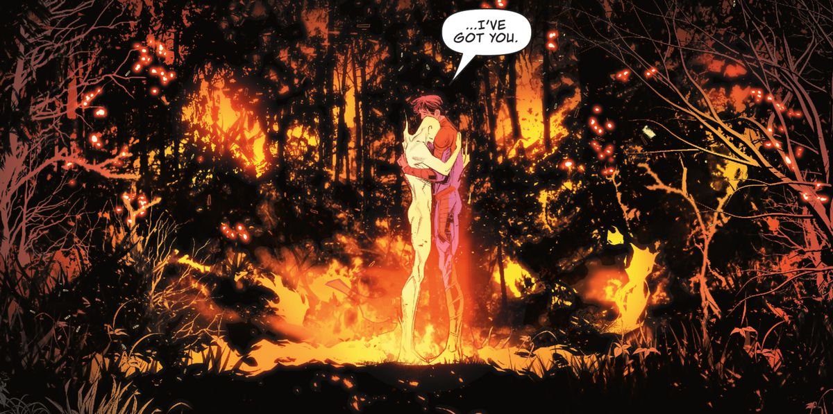 “I’ve got you,” Jon Kent/Superman says, hugging a flaming and naked male figure at the center of a forest fire in Superman: Son of Kal-El #1 (2021).