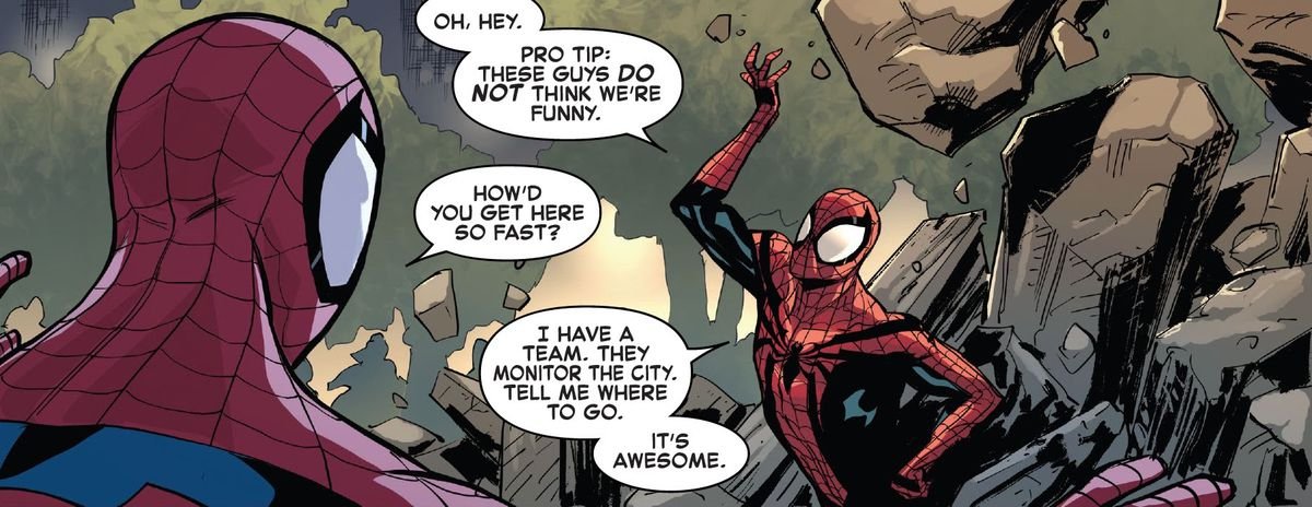 “How’d you get here so fast?” asks Peter Parker Spider-Man of Ben Reilly Spider-Man. “I have a team,” he replies, while shrugging off some heavy debris. “They monitor the city. Tell me where to go. It’s awesome.” In The Amazing Spider-Man #75 (2021).