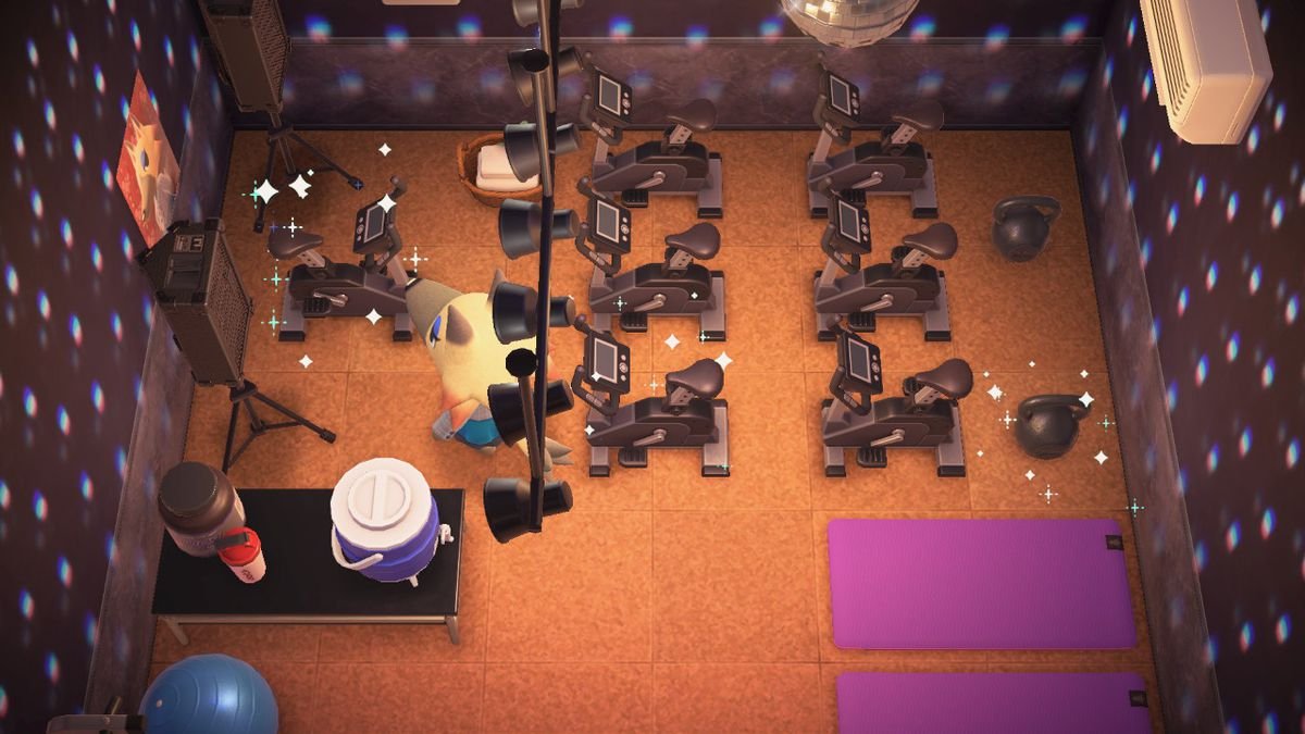 A screenshot from Animal Crossing: New Horizons Happy Home Paradise DLC, with a wolf villager standing in a home gym that looks like a spin class, with tons of spin bikes and several yoga mats.