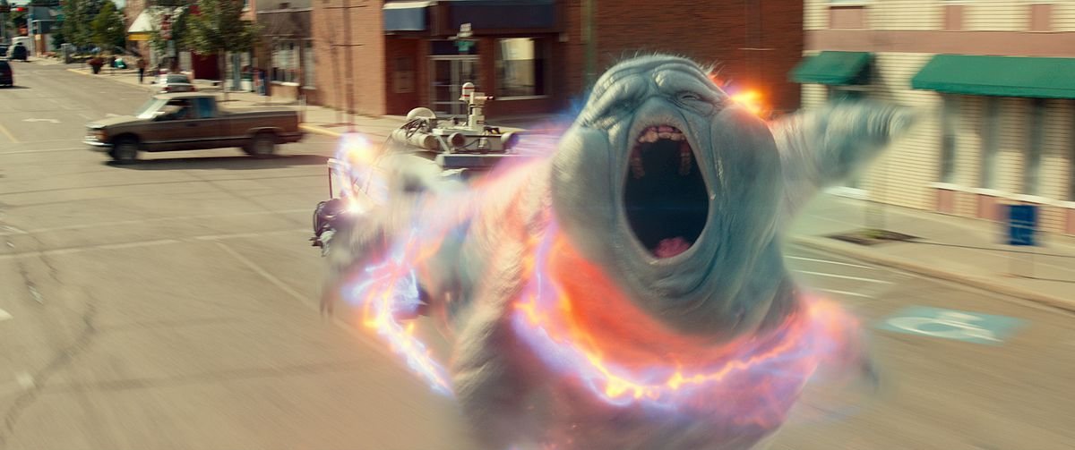 Muncher, the Slimer-like ghost from Ghostbusters: Afterlife, howls as it’s caught in a proton beam