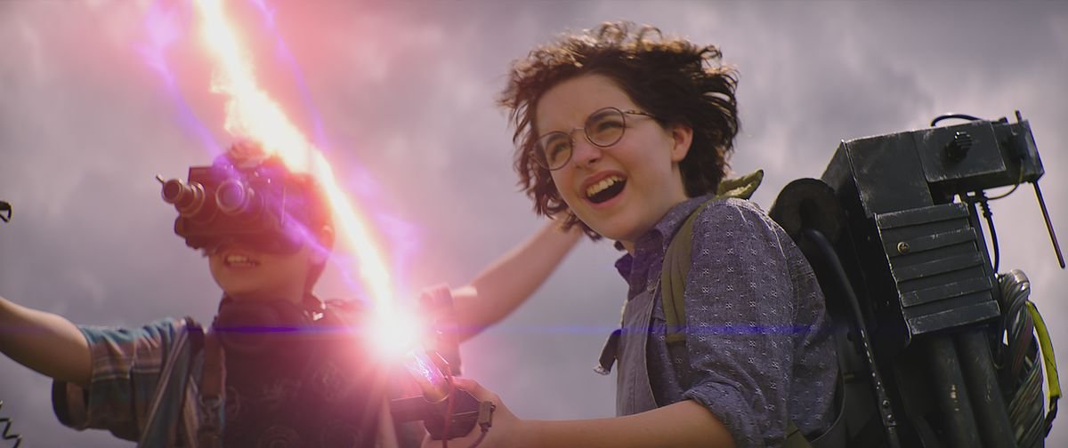 Mckenna Grace with a proton pack in Ghostbusters: Afterlife