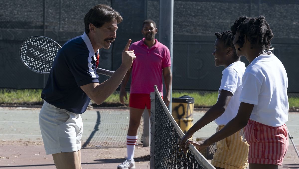 JON BERNTHAL as Rick Macci, WILL SMITH as Richard Williams, DEMI SINGLETON as Serena Williams and SANIYYA SIDNEY as Venus Williams meet at the net in King Richard
