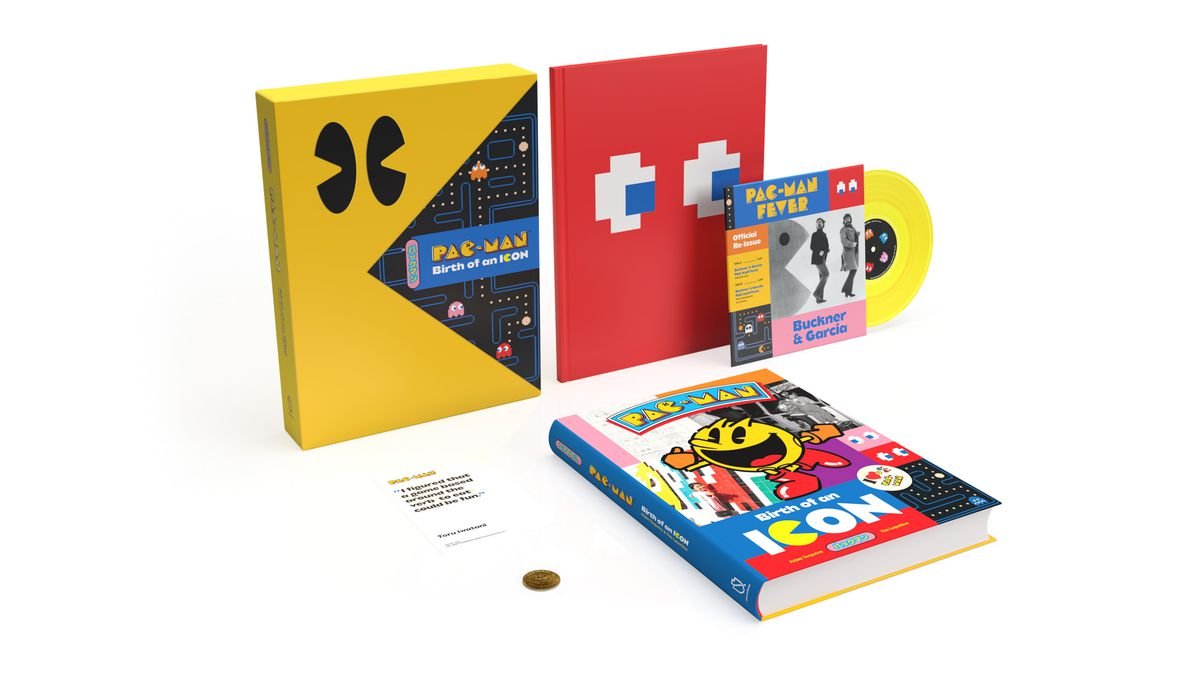 A photo of the individual parts of Pac-Man: Birth of an Icon, including the Pac-Man token and a vinyl single of Pac-Man Fever