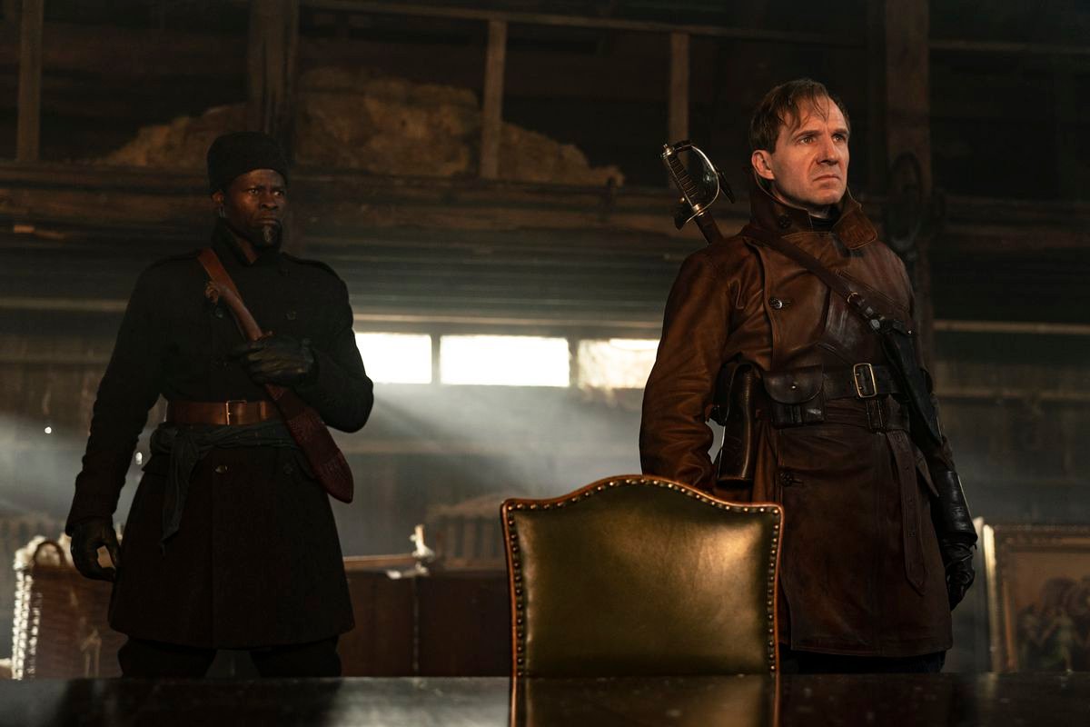 Ralph Fiennes, Djimon Hounsou in adventure gear prepare for a fight in The King’s Man