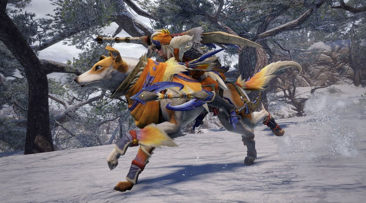 A Hunter rides through the snow on the Palamute in Monster Hunter Rise for PC