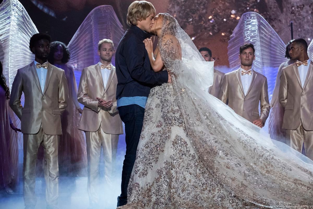 owen wilson smooches jennifer lopez, who is wearing a beautiful crystal-adorned wedding gown 