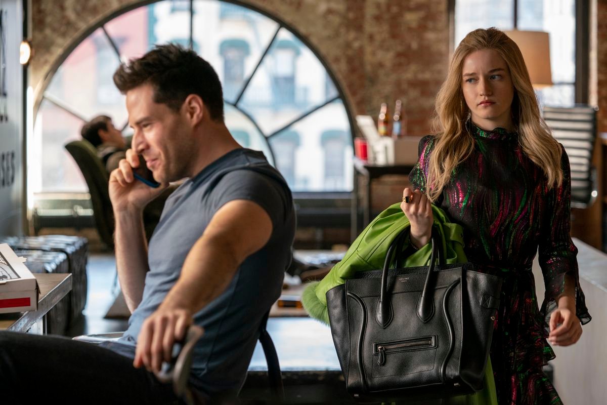 Inventing Anna’s Anna looking disdainfully at some elite man on a phone