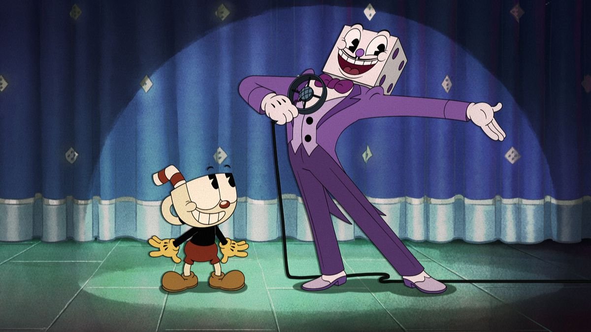 Cuphead looking up at Dice King who’s posing for the crowd