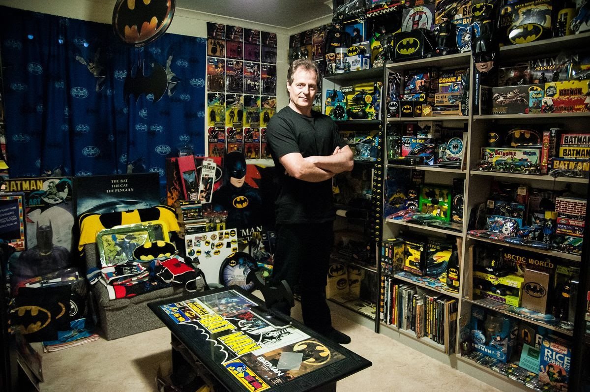 Darren “Dags” Maxwell with his collection of Batman movie memorabilia in Batman and Me