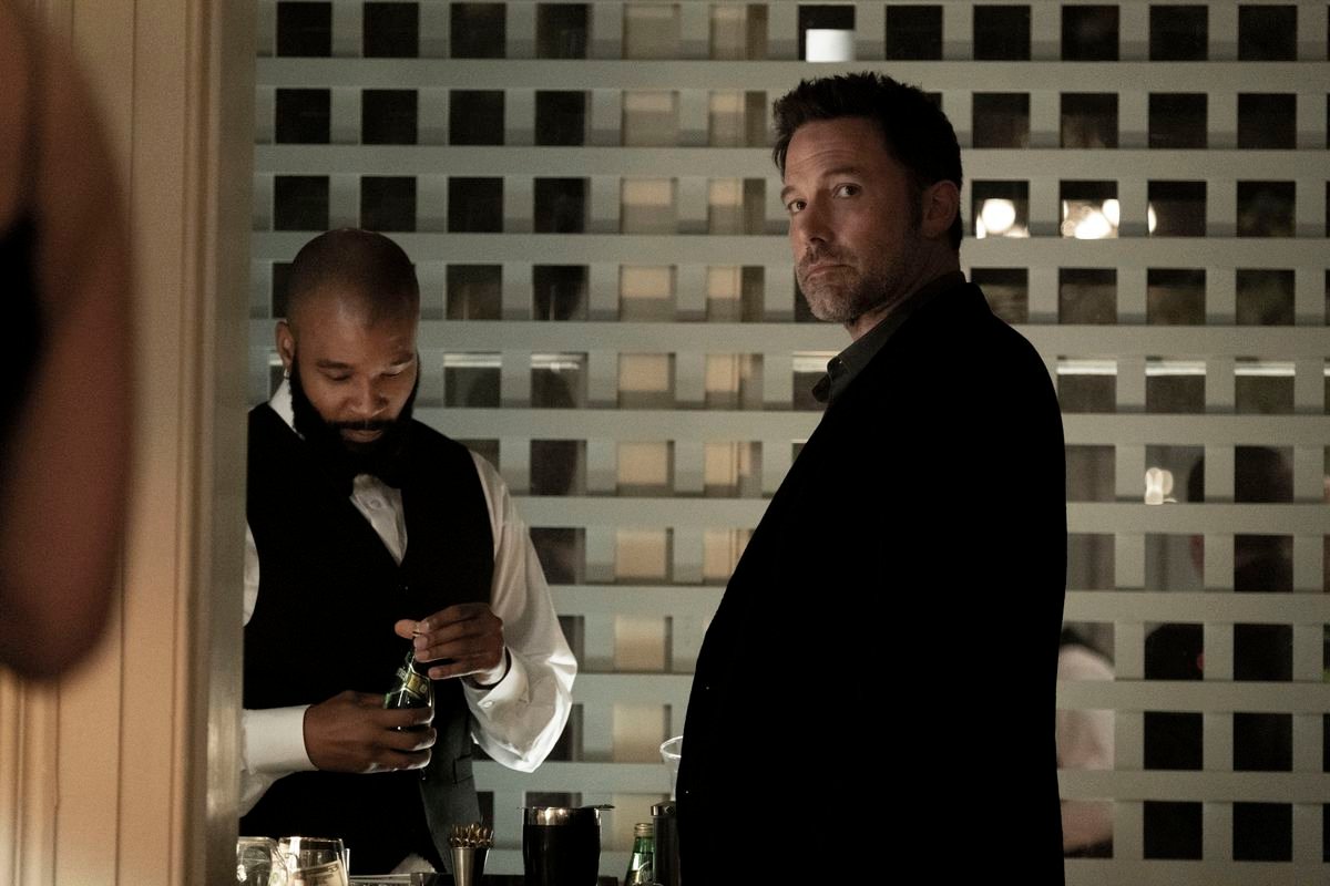Ben Affleck looks over his shoulder at a bar