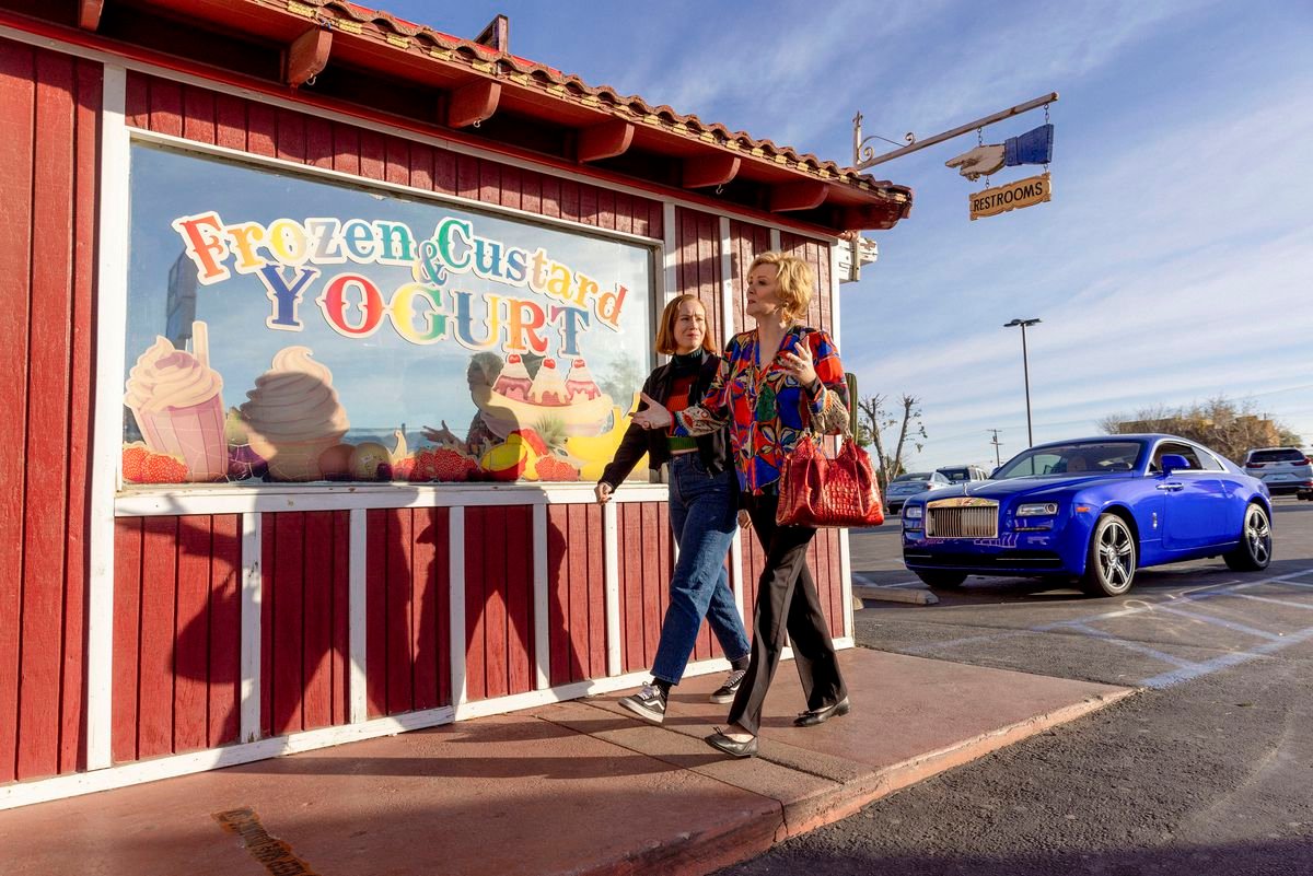 Deborah and Ava walk by a Frozen Yogurt shack in the desert because who wouldn’t want that. 