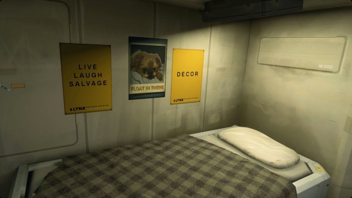 A Hardspace: Shipbreaker screenshot showing a small bed under three poster. The first reads “Live, Laugh, Salvage.” The middle is a puppy with the words “Float in there” below. The third simply reads “Decor.”