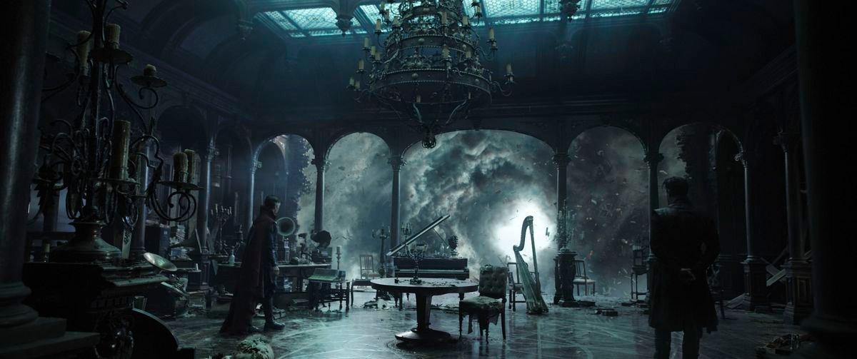 A CGI vista with Benedict Cumberbatch as Doctor Strange standing in a dark room in front of an open wall leading out to clouds swirling around a vast glowing gap in the sky in Doctor Strange in the Multiverse of Madness.