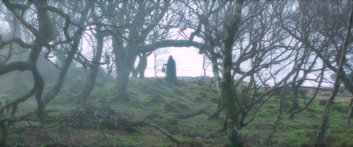 A vista from Shepherd, with a black-robed Death figure among twisted black trees set in a bright green field