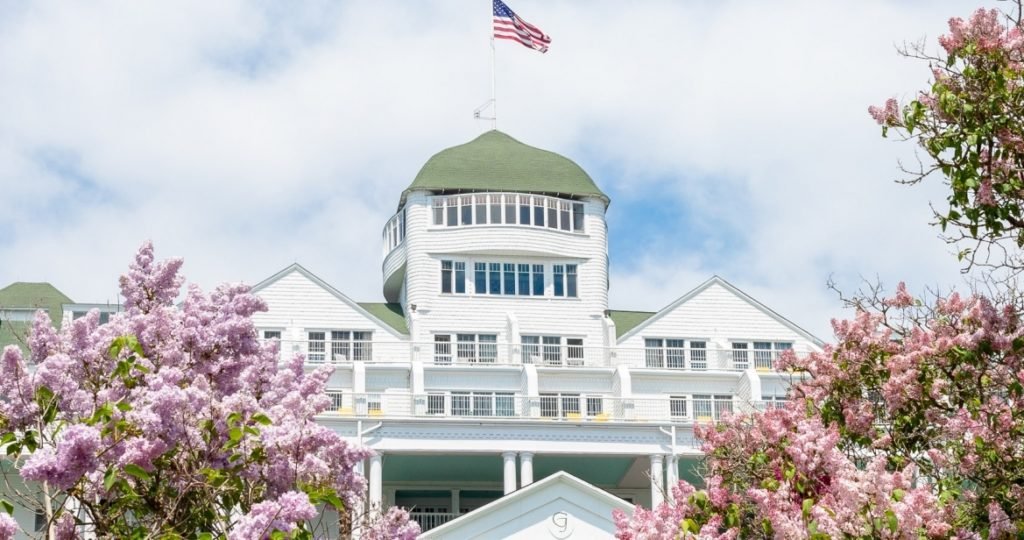 Exterior of the Grand Hotel on Mackinac Island with lilacs in full bloom