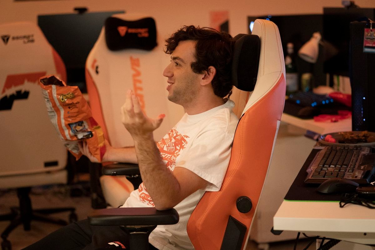 Creamcheese sitting in a Fugitive chair in the scrim room
