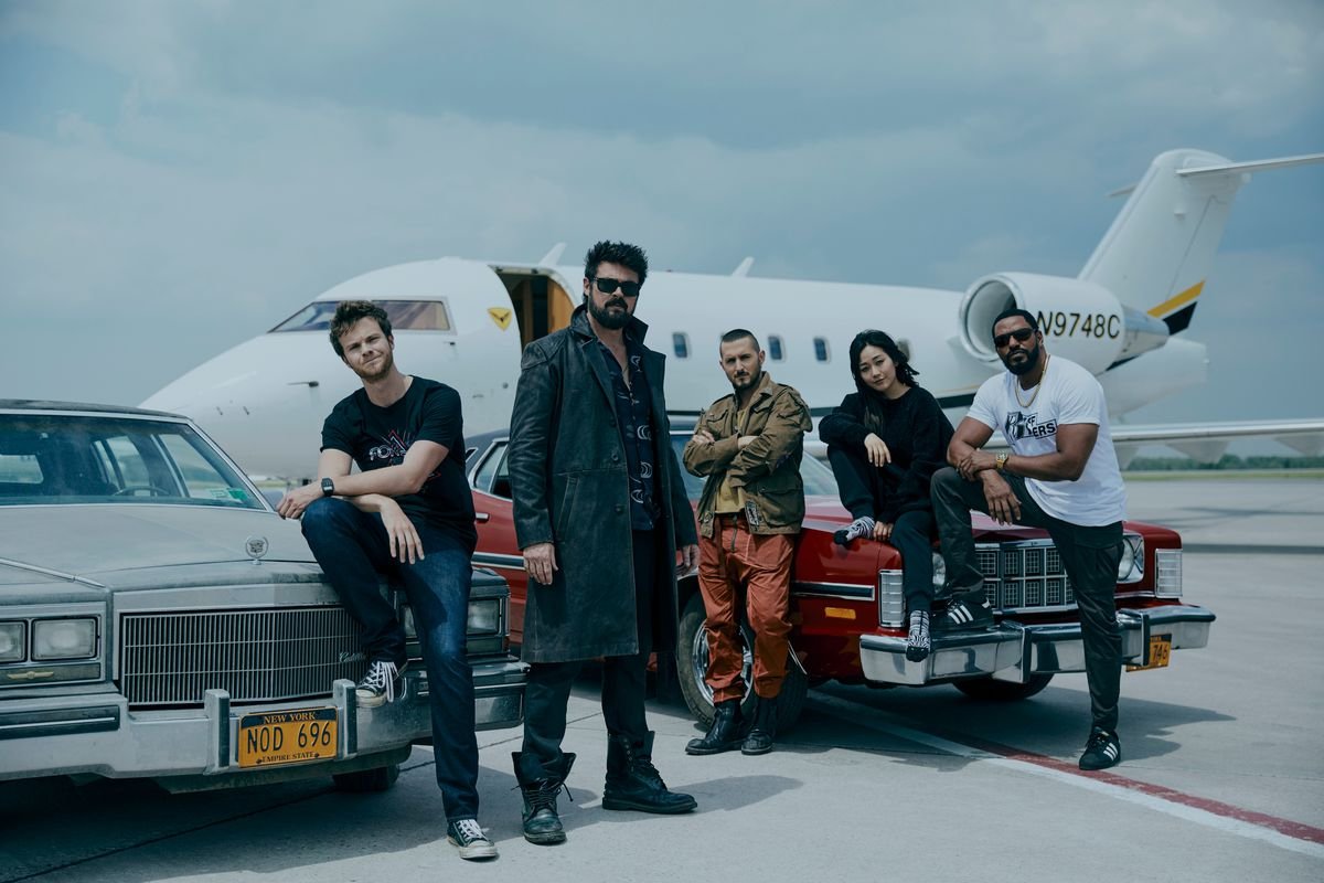 A group shot of the Boys in front of a private jet in season 3 of The Boys