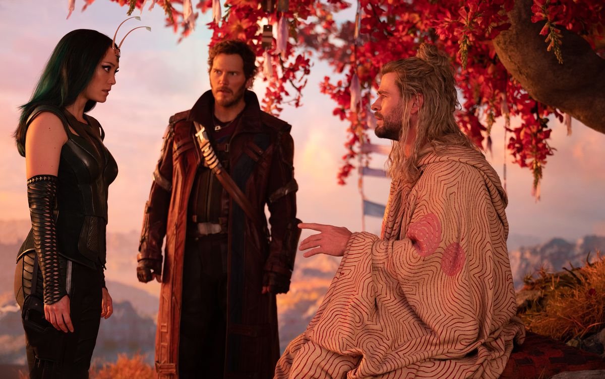 Thor in a robe atop a mountain, talks to Peter Quill and Mantis in Thor: Love and Thunder