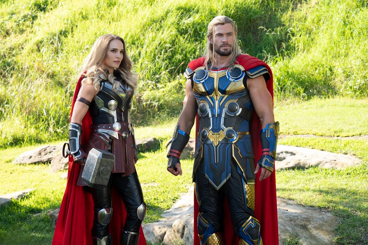 Thor and Jane Foster as The Mighty Thor stand in a field in Thor: Love and Thunder