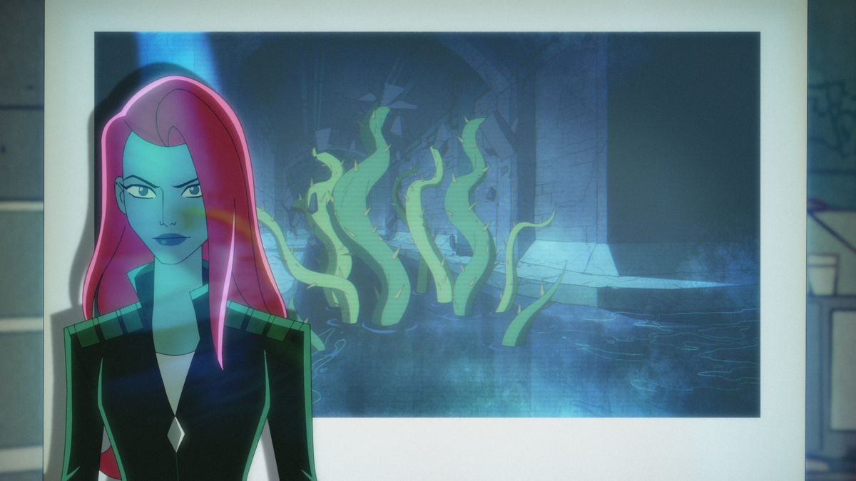 Poison Ivy stands in front of a slide projector of a tentacled plant monster.