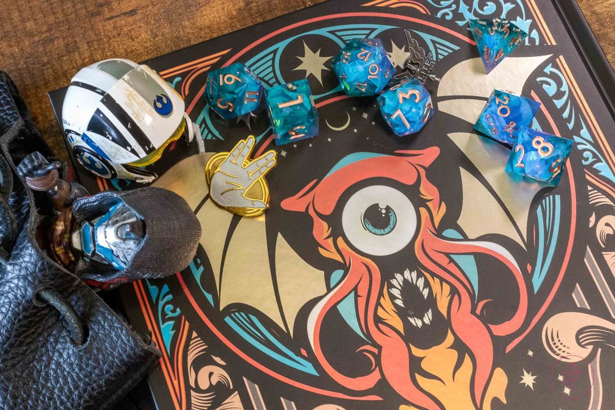 The back of a Spelljammer book with some Dispel Dice, a rebel helmet, and that guy from Destiny.