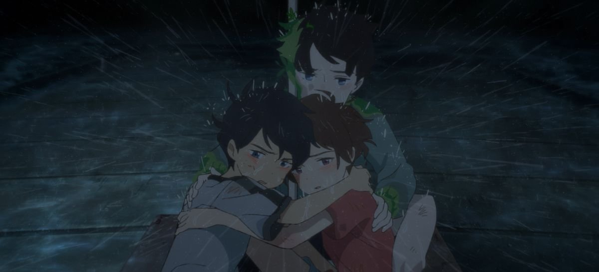 Three children cling together outdoors in a raging rainstorm as one looks defiantly toward the camera in Drifting Home