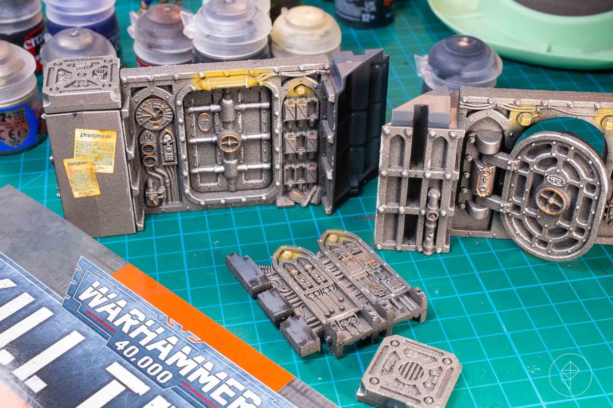 The Into the Dark rulebook alongside some components of the Gallowdark terrain.