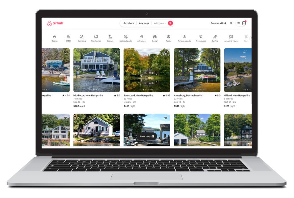 Digital rendering of a laptop showing the homepage of AirBnb