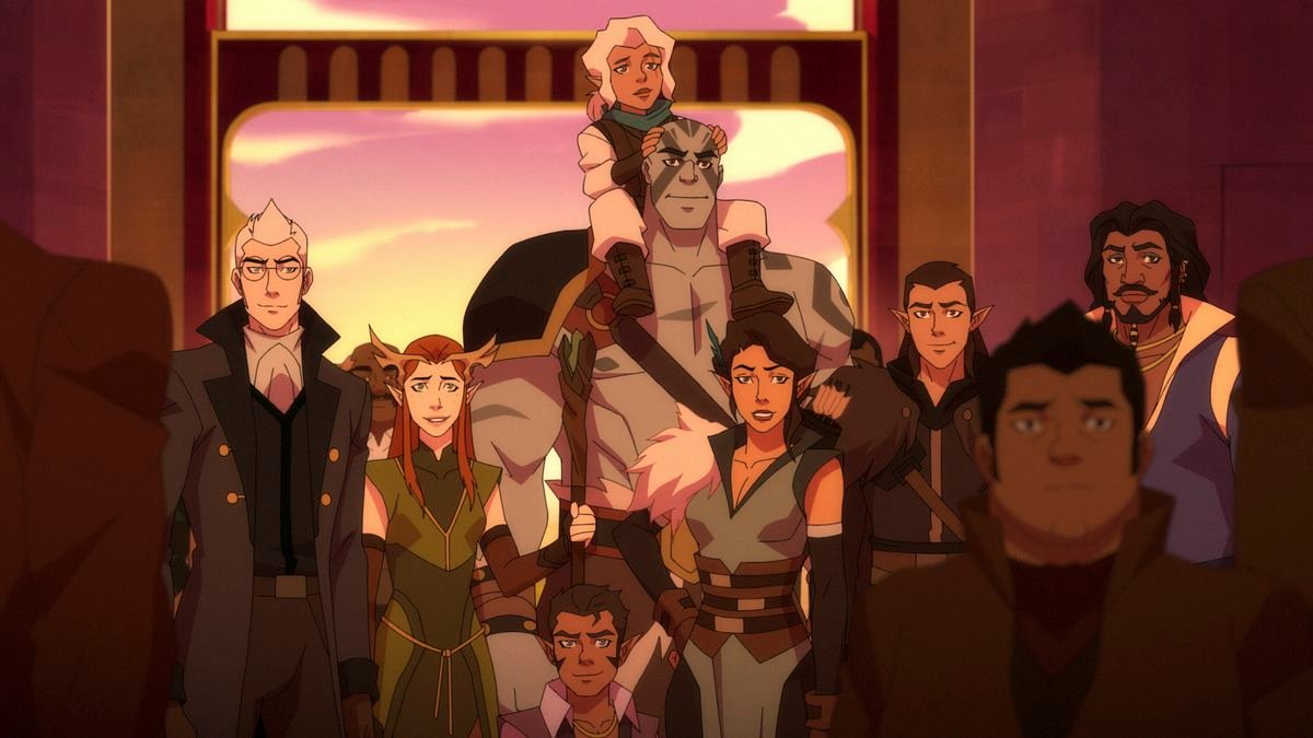 a pale haired aloof human; a redheaded half-elf; a tiny gnome man; a tall, strong goliath with a small gnome woman perched on his shoulders; a grinning half-elf woman; a smirking half-elf man; and a smiling dark-haired human stand in a large crowd